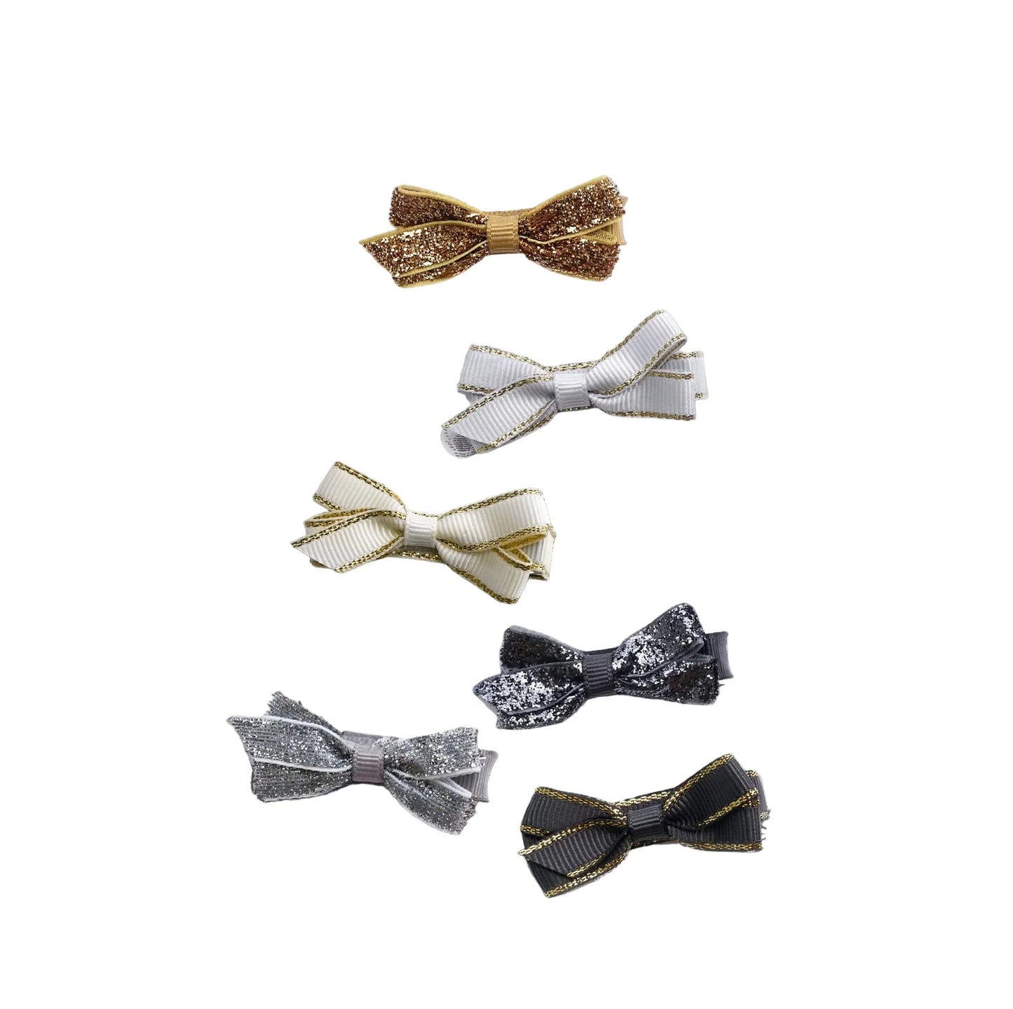 Set of six festive bow hair clips in gold, silver, black, and white from Yellow B.
