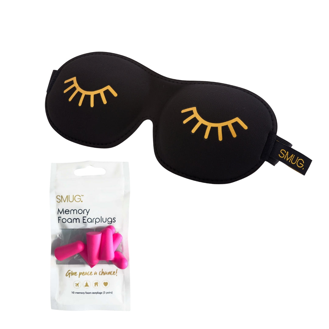 Black contoured sleep mask with gold eyelash print and pink memory foam earplugs set