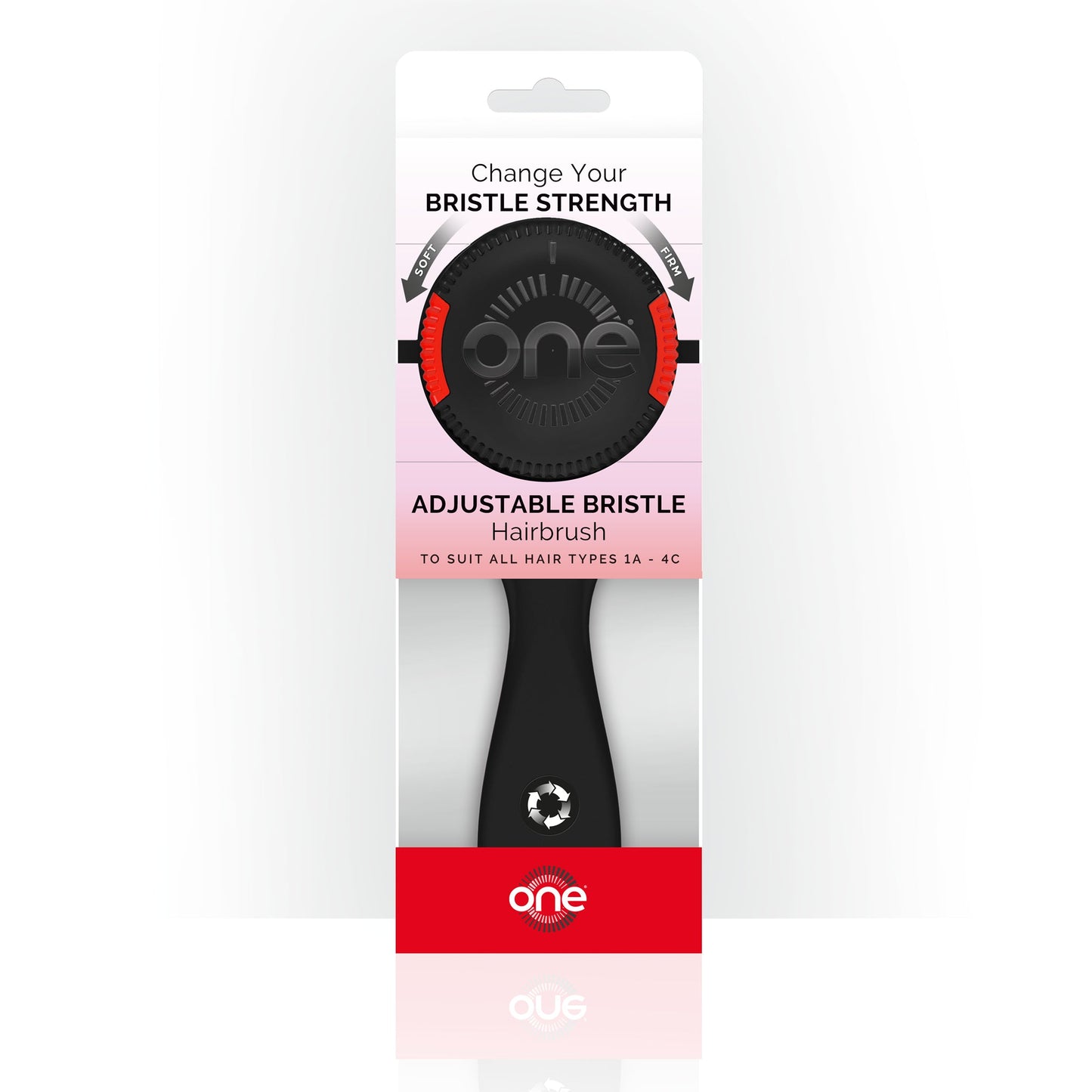 Packaging of Black ONE Brush - Adjustable Bristle Strength Hairbrush with 'one' branding on a white background