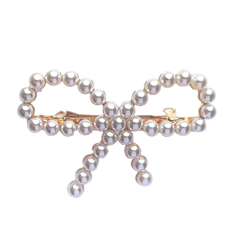 Pearl bow hair clip on a white background
