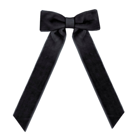 Black medium sized velvet bow hair clip on a white background.