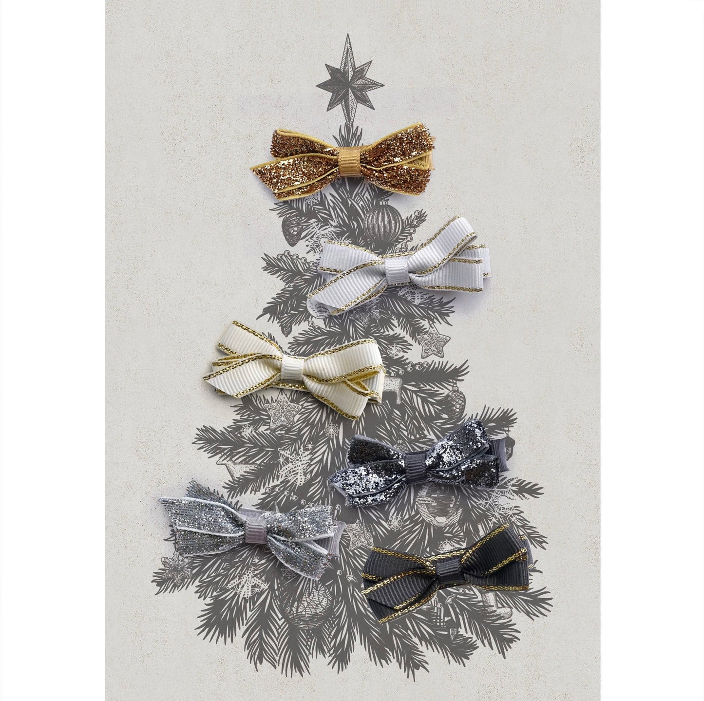 Decorative hair bow set in gold, white, cream, silver and grey, arranged in the shape of a Christmas tree on a textured background.