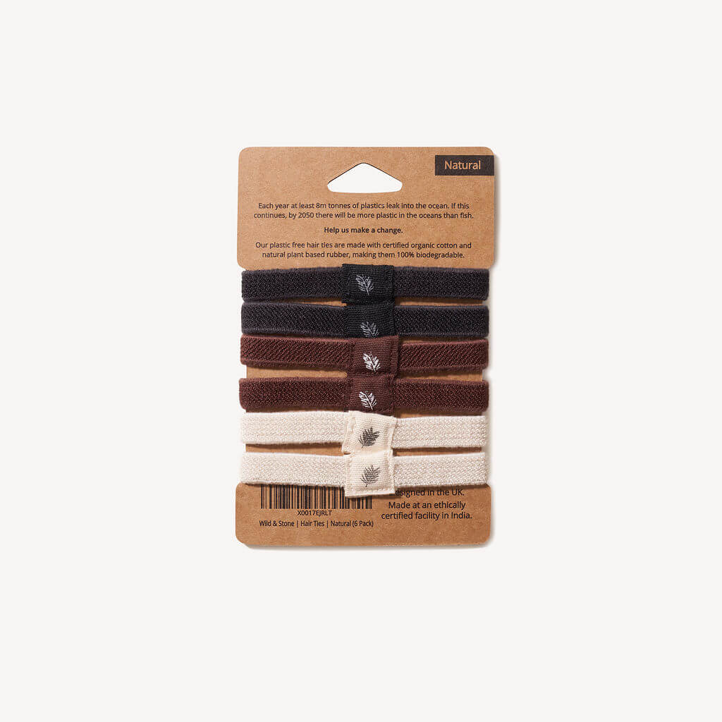 Pack of plastic-free, metal-free, biodegradable hair ties with a Wild & Stone brand label on a white background