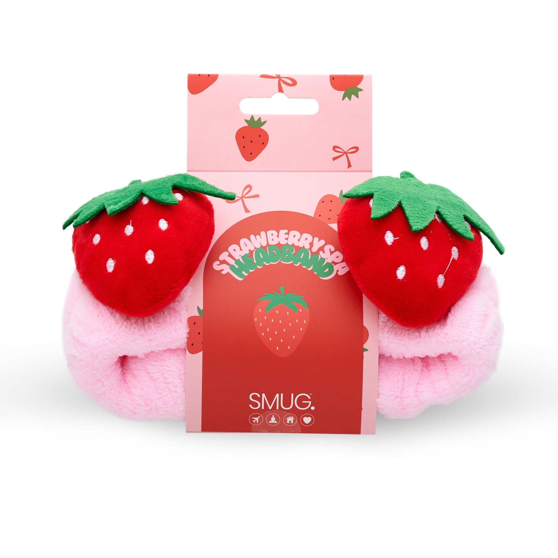 Pink plush SMUG strawberry themed spa headband with a pink packaging label on a white background