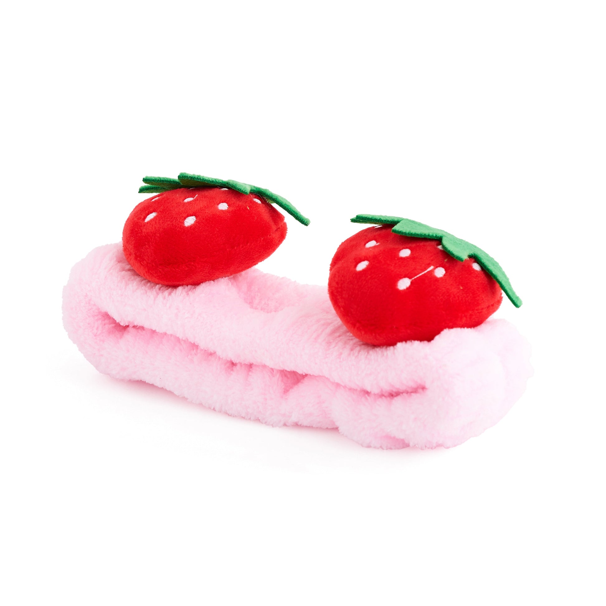 Pink plush SMUG strawberry themed spa headband on a white background