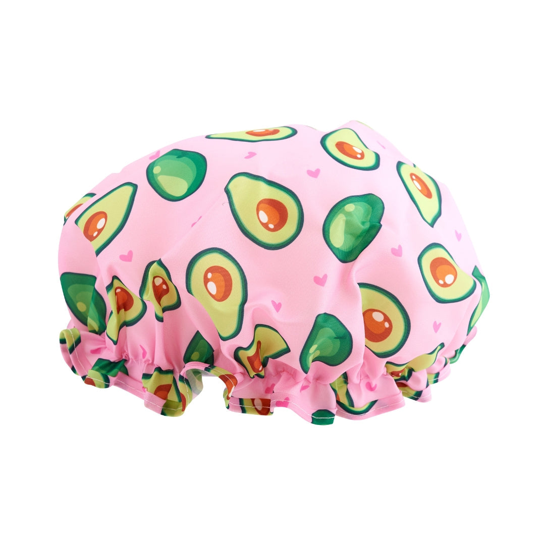 Pink SMUG shower cap with avocado pattern on a white background