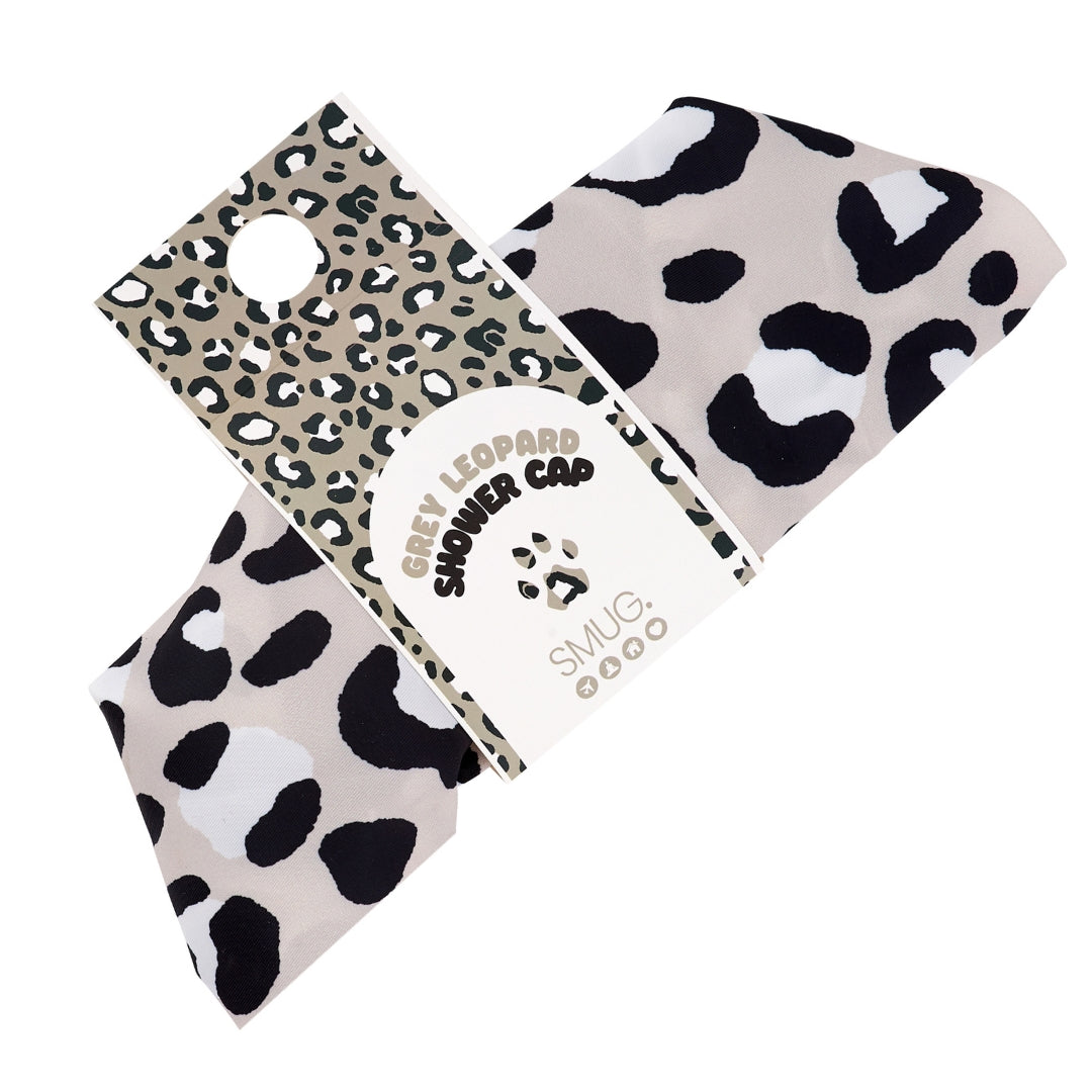 SMUG leopard print shower cap with packaging on a white background