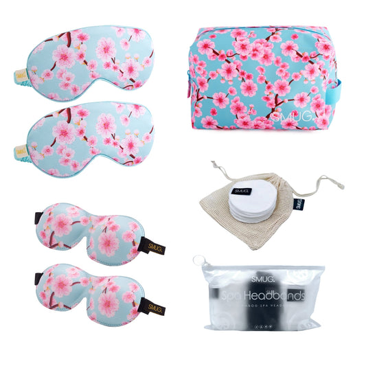 SMUG Sleepover Set in Cherry Blossom print with two satin sleep masks, two contoured sleep masks, wash bag, bamboo cleanse pads and spa headbands.