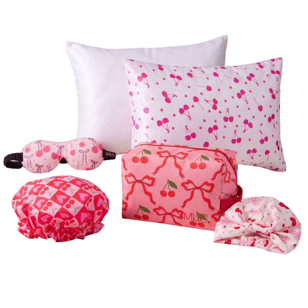 SMUG The Cherry Dream Gift Set with satin pillowcases, sleep turban, shower cap, contoured sleep mask and wash bag.