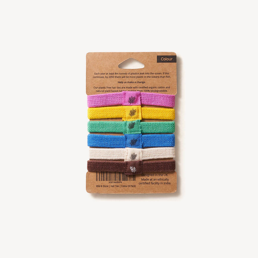 Set of Colourful Plastic-Free Hairbands on a cardboard packaging with a white background